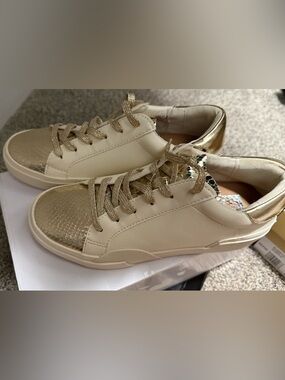 Dolce Vita Cream and Metallic Gold Sneakers